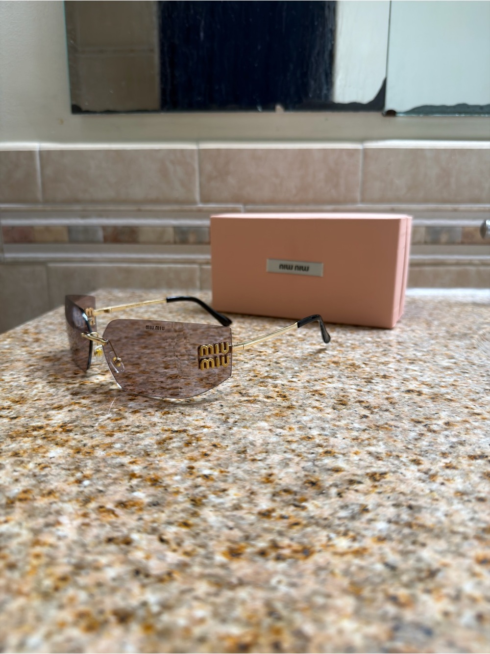Miu Miu Pink Rimless Sunglasses with Gold Logo Accents